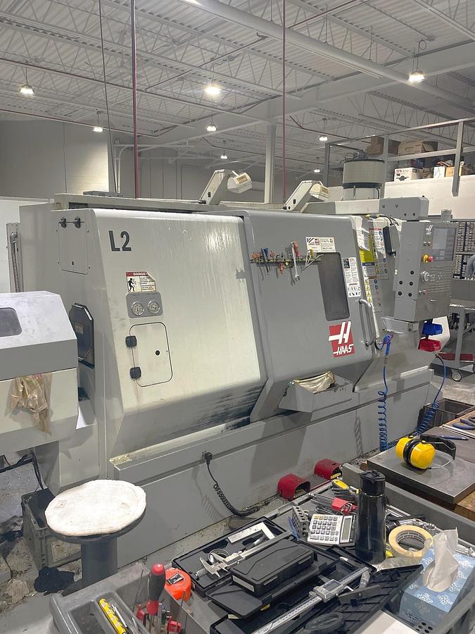 Used 2006 Haas SL-30T with Haas Servo 300 Barfeeder, 3" Bar Capacity, 10" Chuck, Tailstock, Toolsetter, Chip Auger, 12 Pos. Block Turret