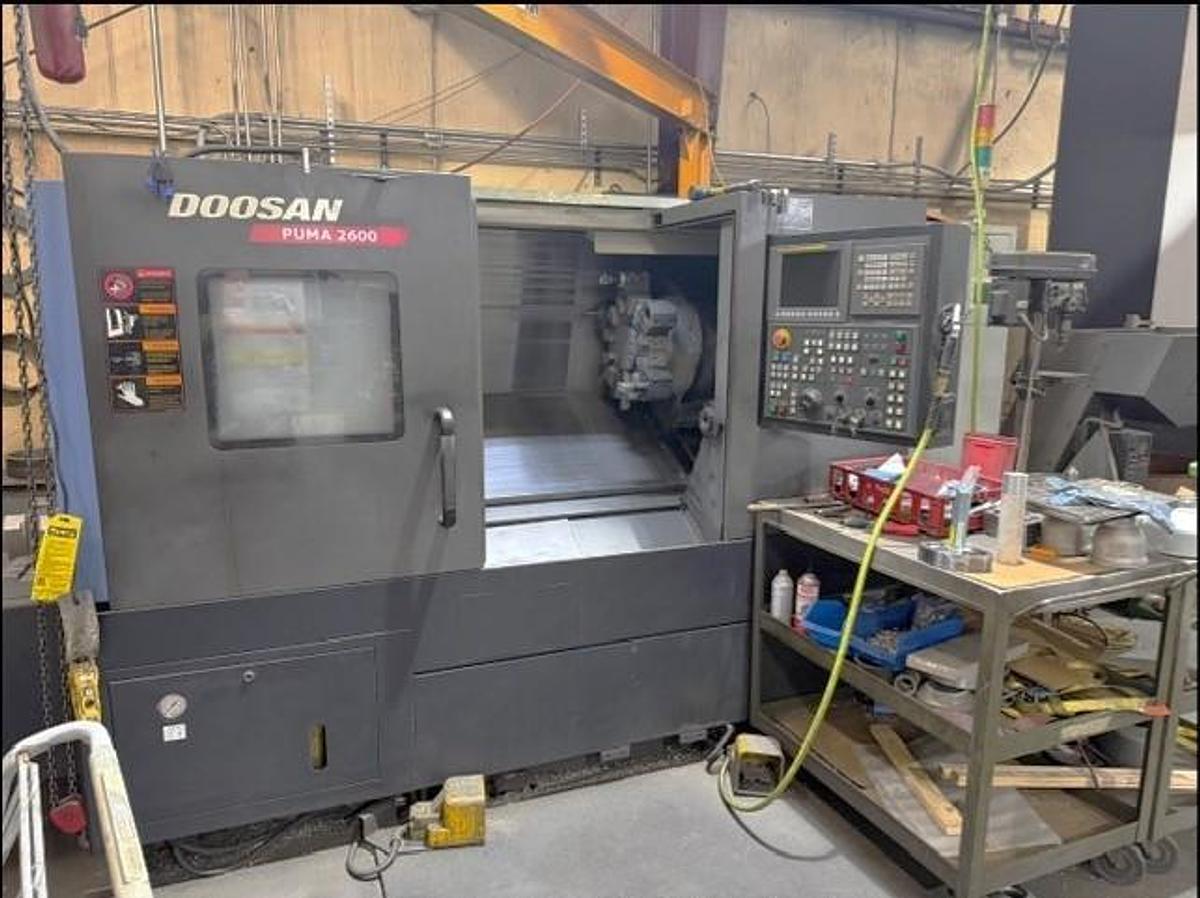 Used 2011 Doosan Puma 2600 with 10" Chuck, Tailstock, Tool Presetter, Chip Conveyor, Fanuc 0i Control
