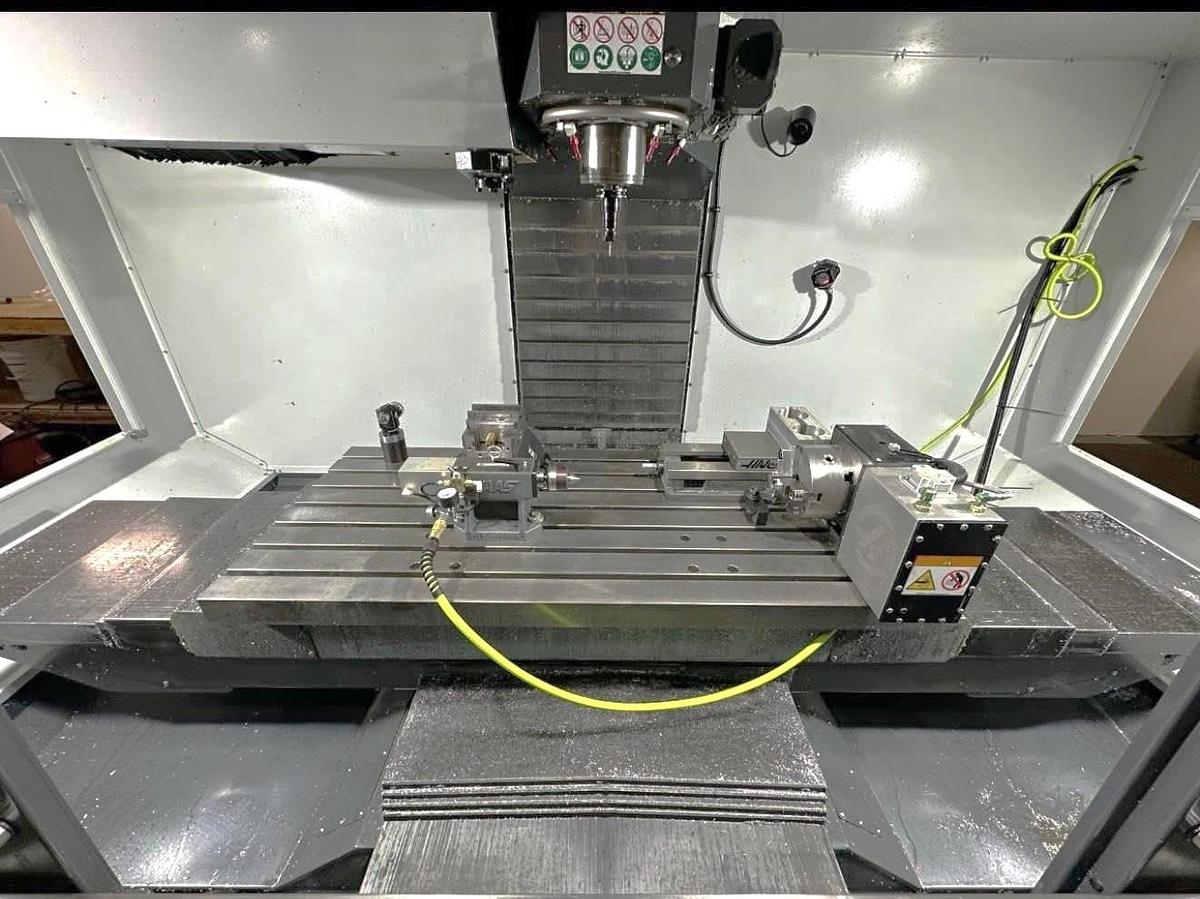 Used 2021 Haas VF-5SS with Haas HRT-160 4th Axis Table, Probing, PCool, Auger, 4th & 5th Axis Drives, Mist Collector, Tooling