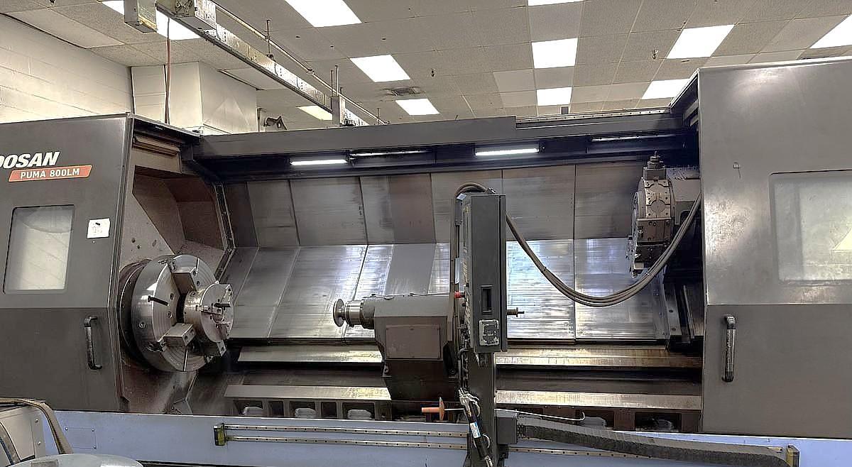 Used 2015 Doosan Puma 800LM with C Axis & Milling, 32" 4 Jaw Manual Chk, 12.6" Bar Cap., 126" Turn Length, New RIP Steady Rest, Tailstock, Conveyor