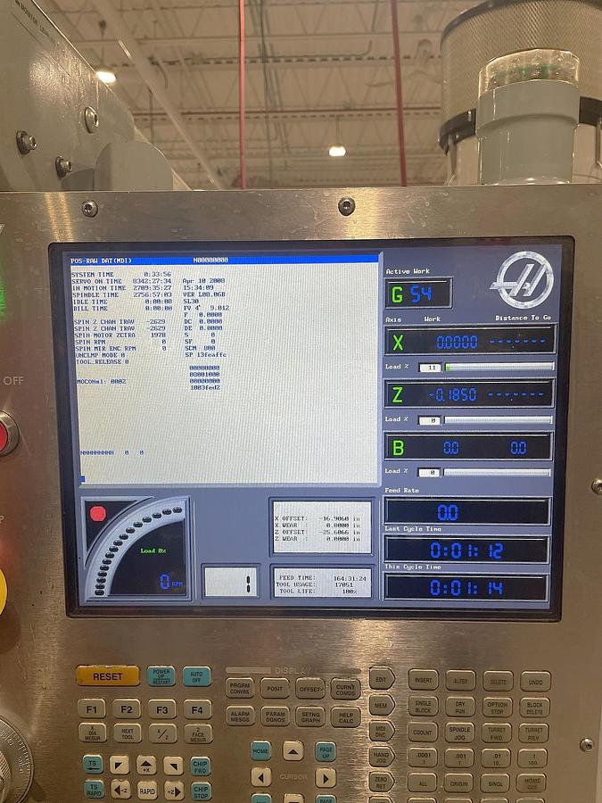 Used 2006 Haas SL-30T with Haas Servo 300 Barfeeder, 3" Bar Capacity, 10" Chuck, Tailstock, Toolsetter, Chip Auger, 12 Pos. Block Turret