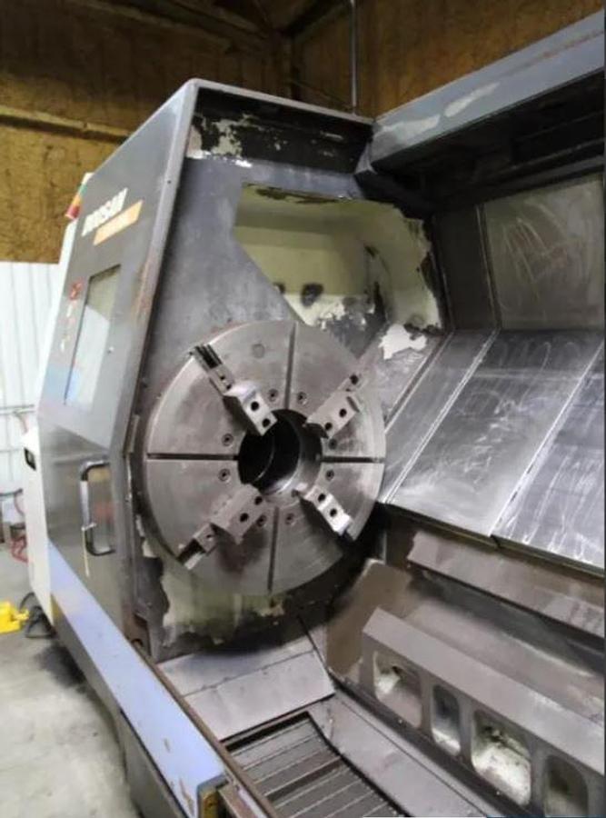 Used 2008 Doosan Puma 800L with, 39.4" 4 Jaw Man. Chk, 12.6" Bar Cap., 35.4" Turn Diam., 126" Turn Length, Tailstock, Conveyor