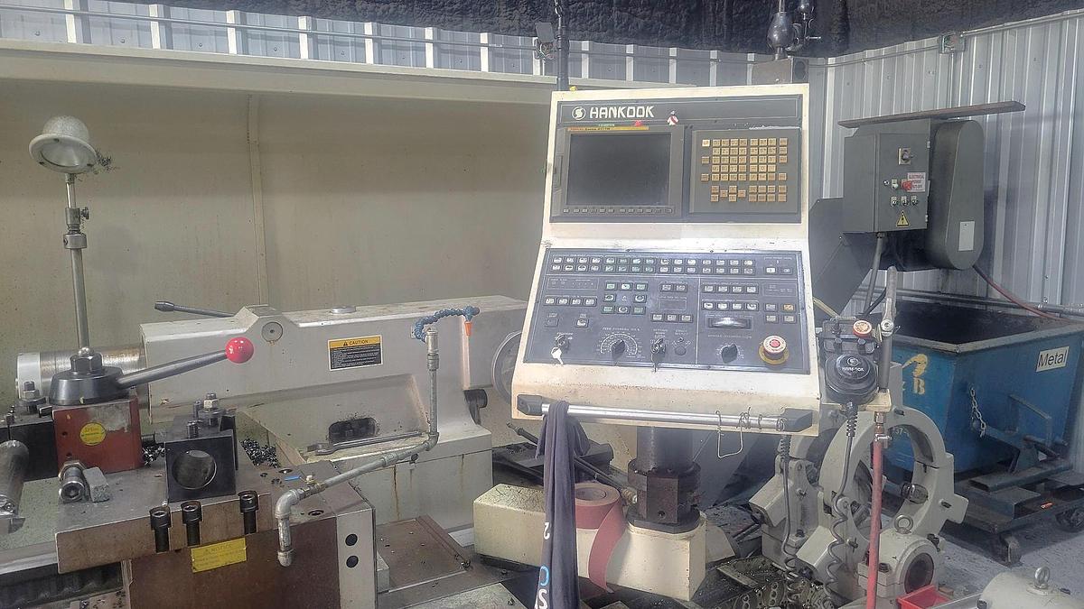 Used 2006 Hankook Protec 9NC/4000 with 10" Bar Capacity, 160" Centers, (2) 25" Manual Chucks, Fanuc 21iTB Control