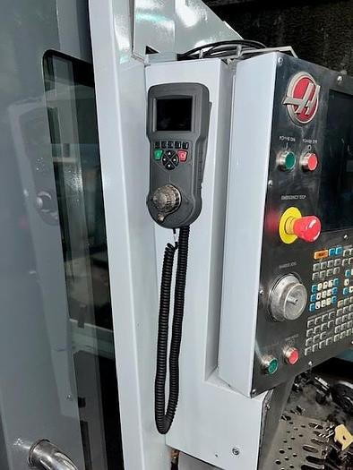 Used 2014 Haas VF4 with Haas HRT210 4th Axis Rotary Table, 24 Station SMATC, PCool, Chip Auger