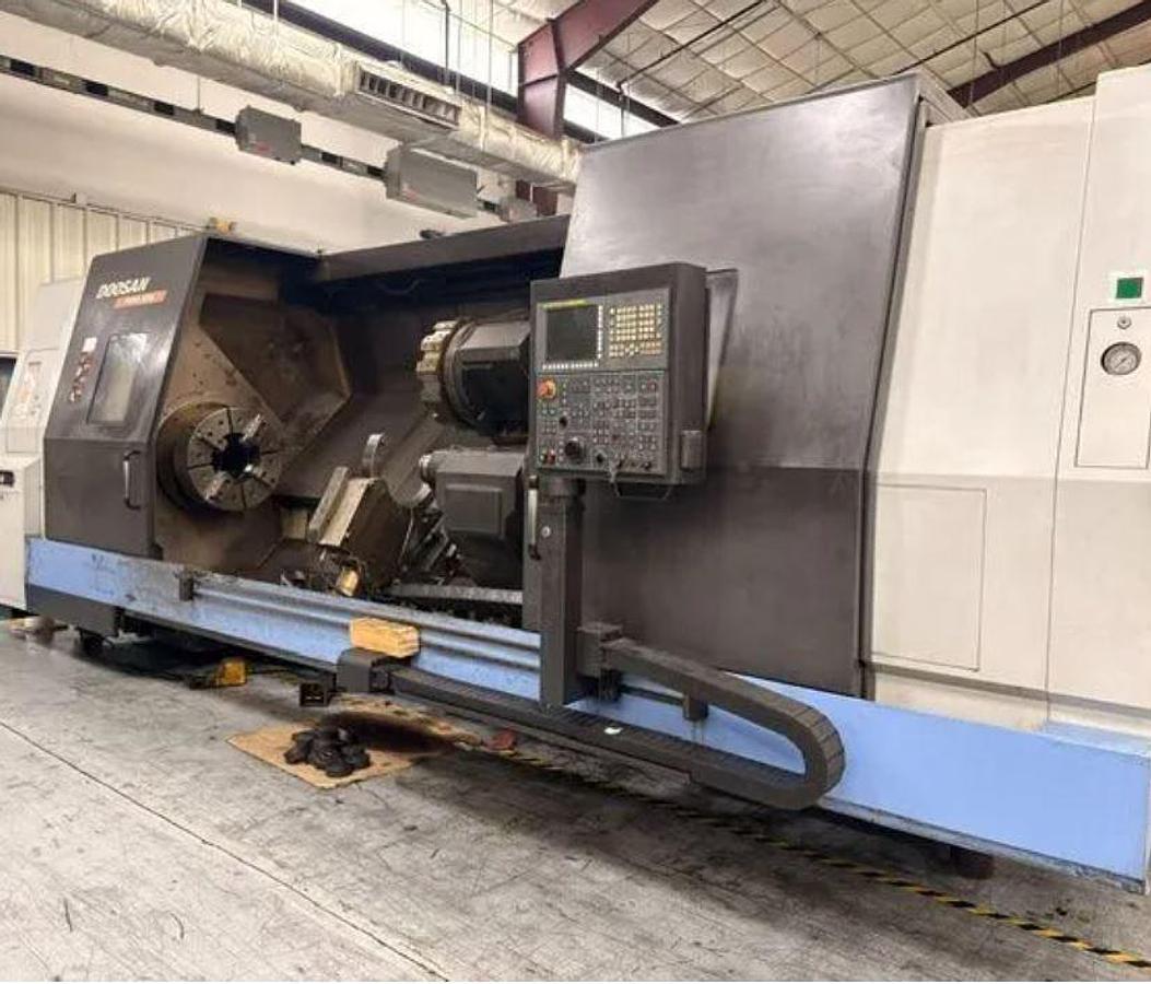 Used 2012 Doosan Puma 800L with, 24" 4 Jaw Man. Chk, 12.6" Bar Cap., 35.4" x 126" Capacity, Steady Rest, Tailstock, Conveyor