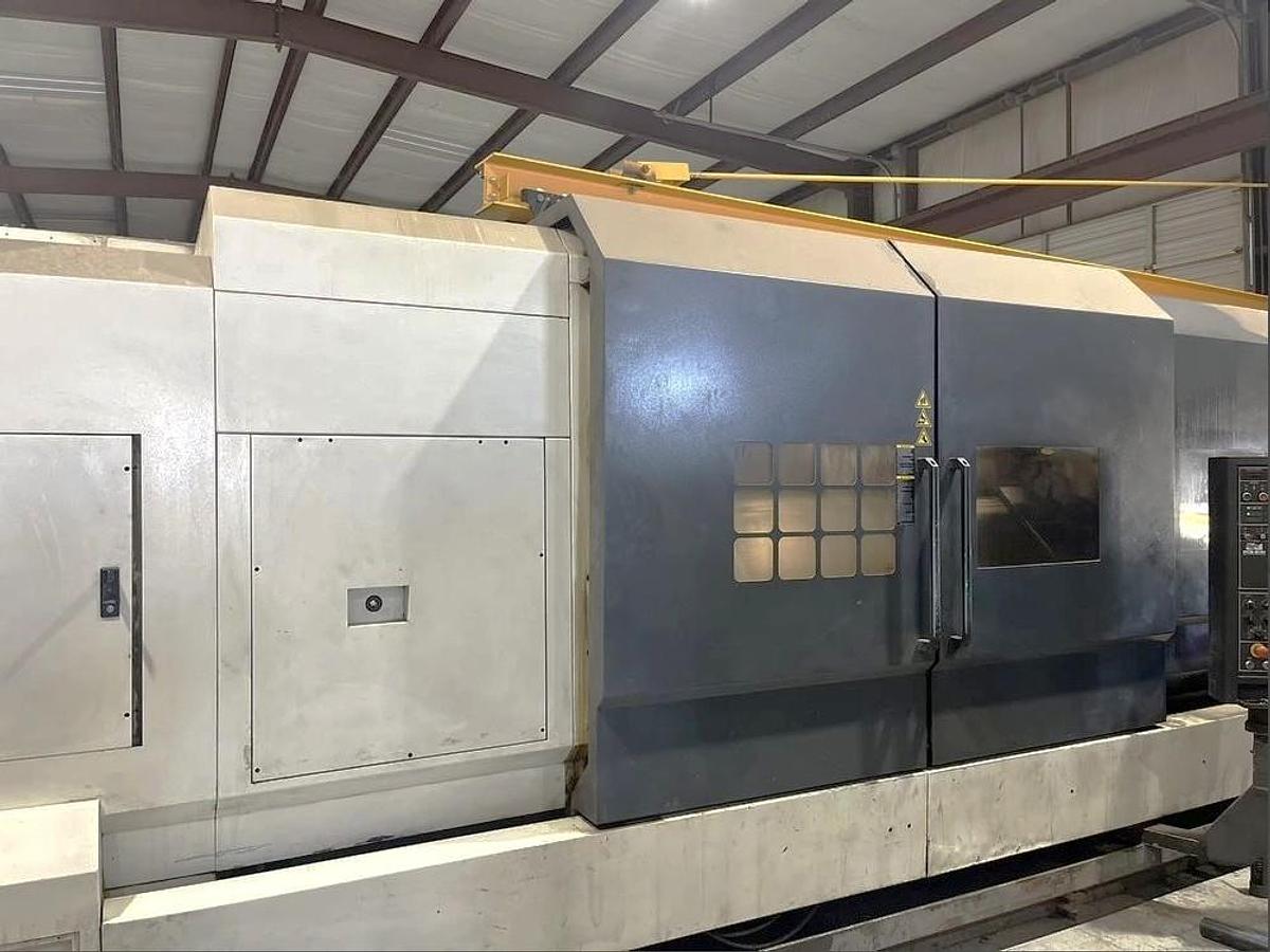 Used 2012 Chevalier FBL-530C with 12.59" Bore, 32" 4 Jaw Manual Front Chk, 28" Rear Air Chk, Tailstock, 118" cc, 500 RPM, Conveyor 