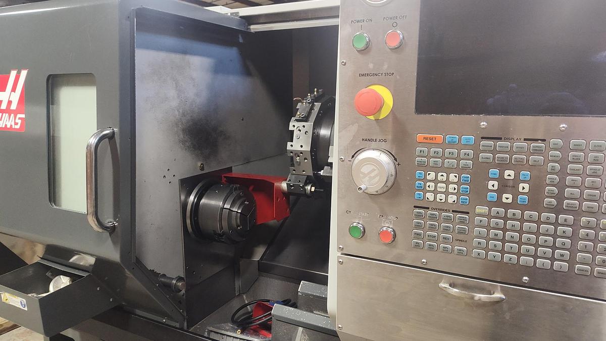 Used 2015 Haas ST-30 Chucker with Haas Servo Bar 300 Barfeed, Chip Conveyor, Parts Catcher, 10" Chuck, 3" Bar Capacity