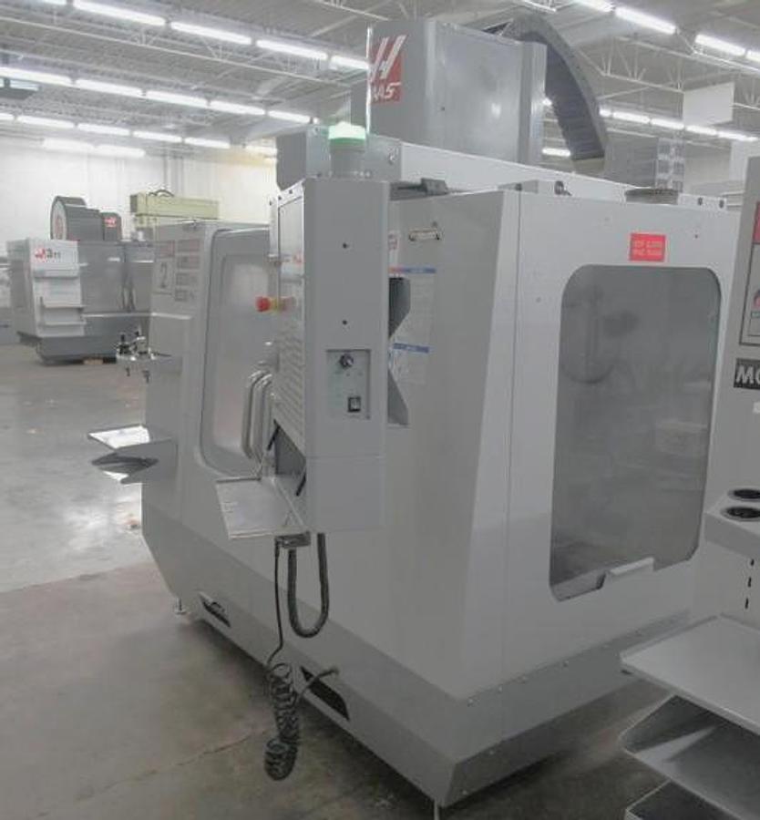 Used 2007 Haas VF2SS with Probing, Chip Auger, Progr. Coolant Nozzle, 24 Station SMATC, Jog Handle, Stevens Fixture Plate