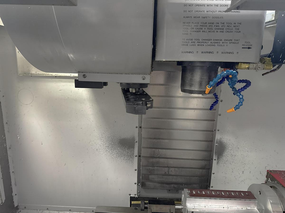 Used 2002 Haas VF2D with Haas Rotary Table, 24 Station Side Mount ATC, Chip Auger, Programmable Coolant