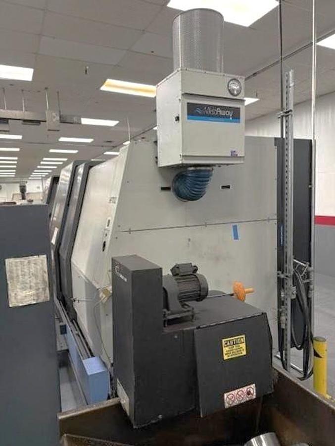 Used 2006 Doosan Puma 700L with 24" Hyd. Chk, 6.5" Bar Cap., 126" Turn Length, SMW Steady Rest, Tailstock, Conveyor, Tool Eye