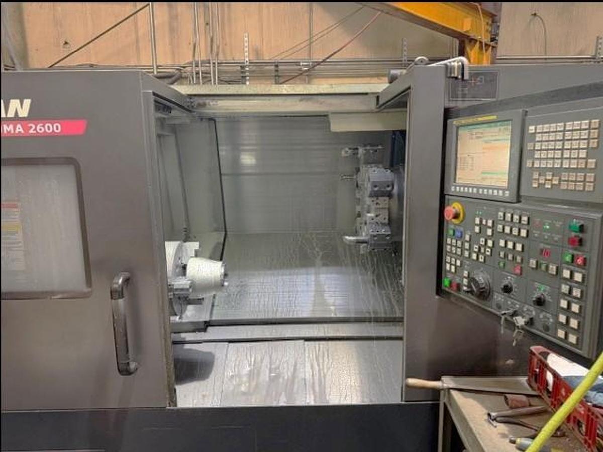 Used 2011 Doosan Puma 2600 with 10" Chuck, Tailstock, Tool Presetter, Chip Conveyor, Fanuc 0i Control