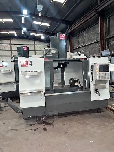 Used 2014 Haas VF4 with Haas HRT210 4th Axis Rotary Table, 24 Station SMATC, PCool, Chip Auger