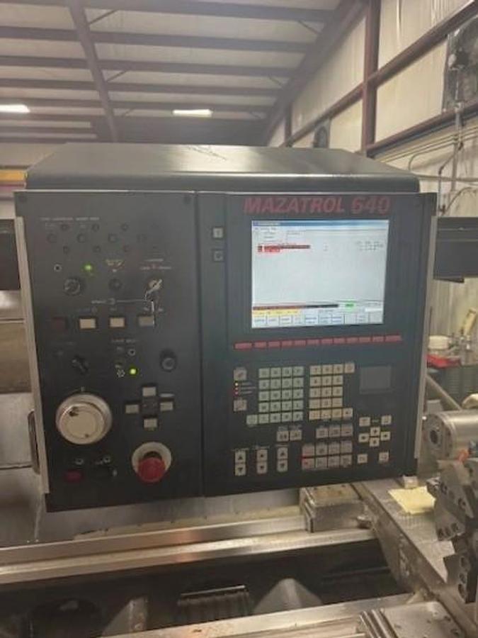 Used 2007 Mazak Powermaster 3000U  w/ 10.2" Bore, (2) 18" 4 Jaw Manual Chucks, Chip Conveyor, Tailstock