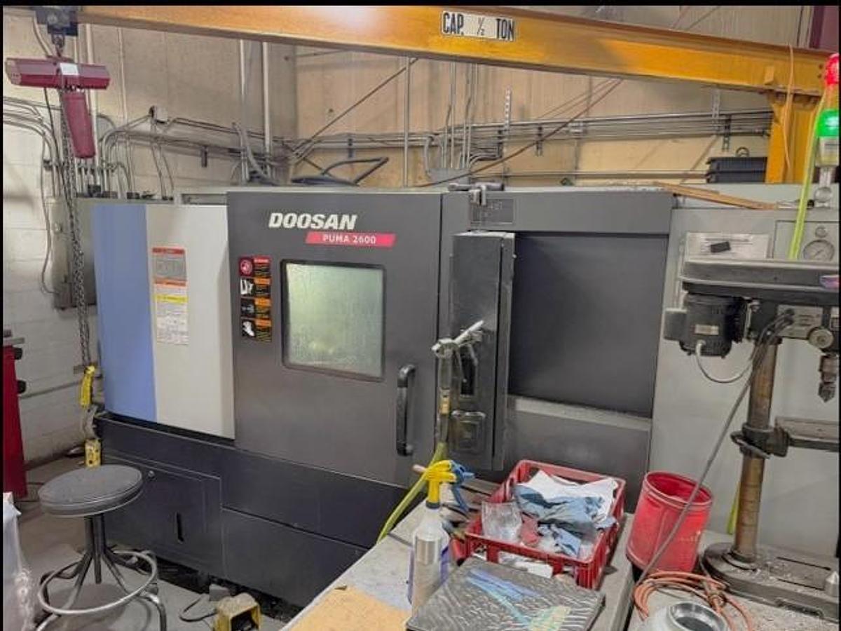 Used 2011 Doosan Puma 2600 with 10" Chuck, Tailstock, Tool Presetter, Chip Conveyor, Fanuc 0i Control