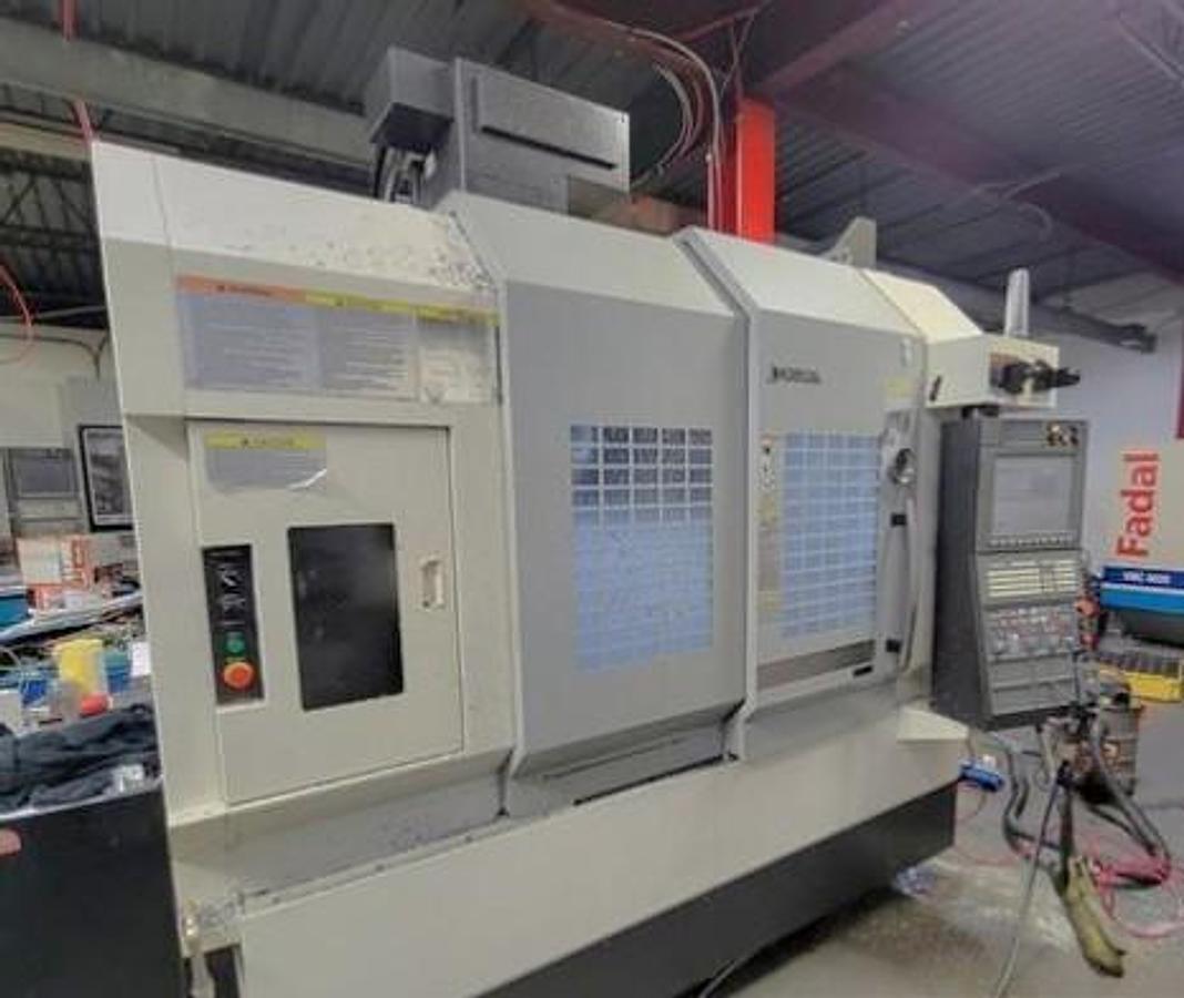 Used 2015 Okuma M560-V with 4th Axis Rotary Table, Renishaw Tool & Part Probing, 15k RPM, 32 Pos. ATC, Chip Claster HPC