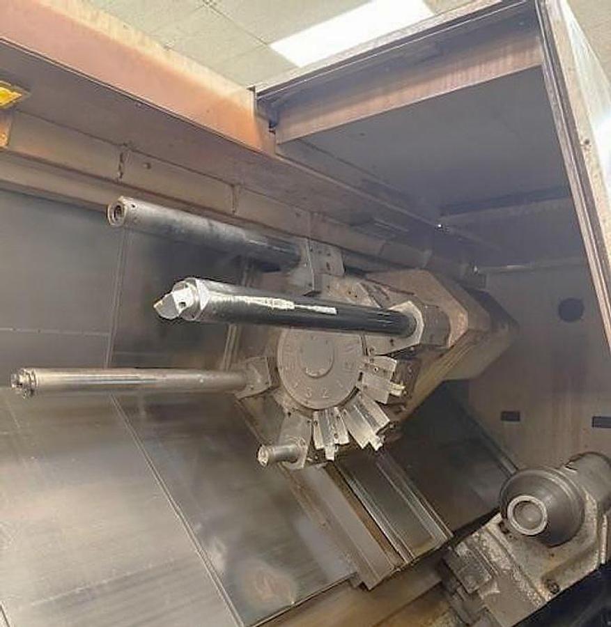 Used 2006 Doosan Puma 700LM with C Axis & Milling, 32" 4 Jaw Man. Chk, 6.5" Bar Cap., 126" Turn Length, SMW Steady Rest, Tailstock, Conveyor