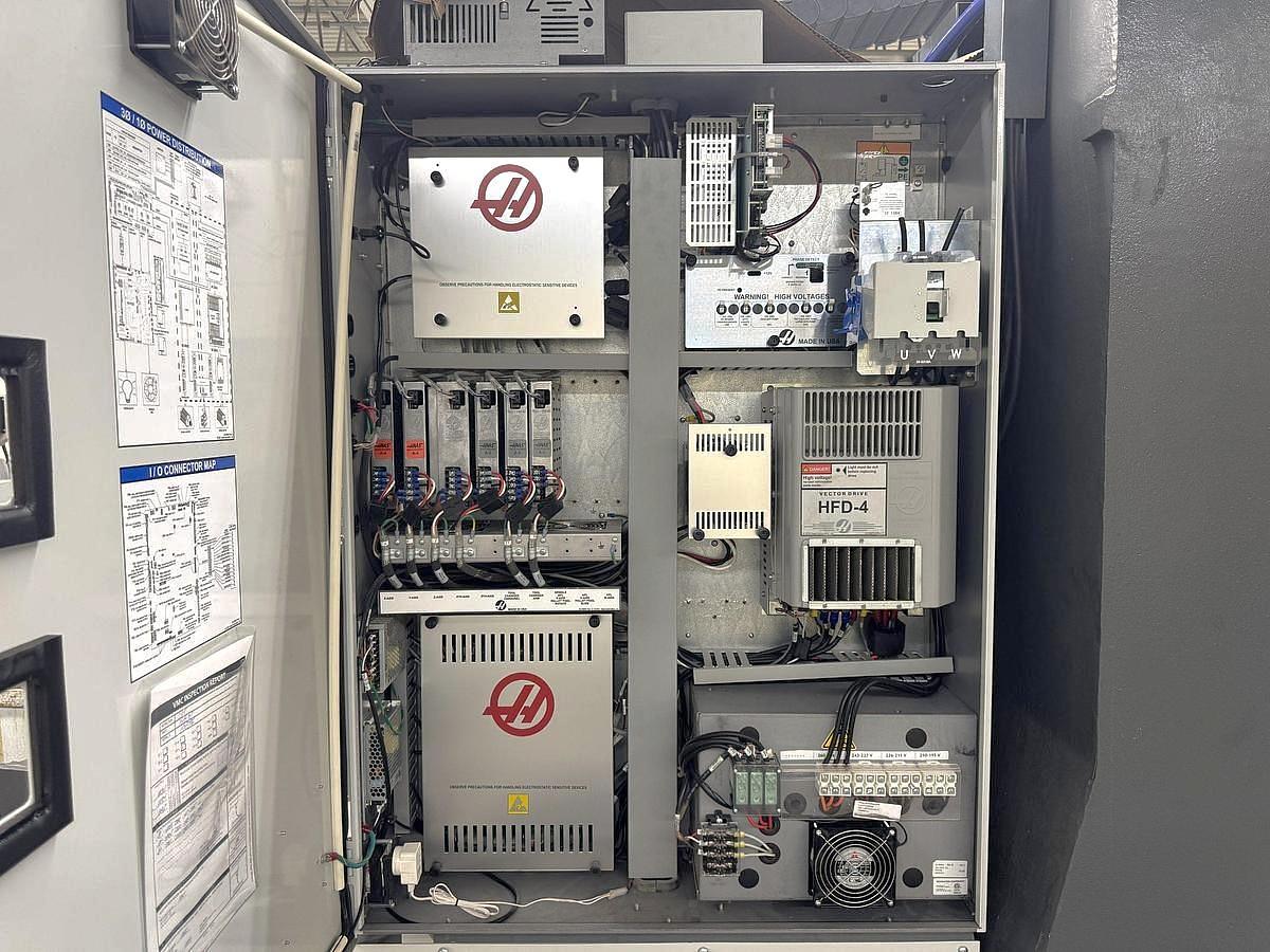 Used 2021 Haas VF-5SS with Haas HRT-160 4th Axis,15k RPM, Probing, TSC, PCool, Auger, 4th & 5th Axis Drives, Mist Collector, Tooling