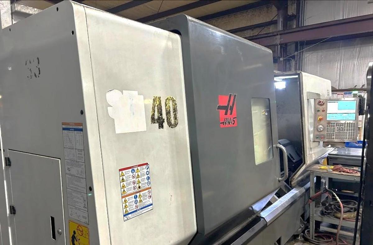 Used 2014 Haas ST-40 with Tailstock, Chip Conveyor, 15" Hydraulic Chuck, Tool Presetter, Remote Jog Handle, 3,278 Feed Cut Hours