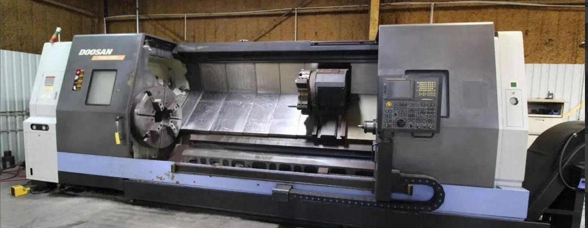 Used 2008 Doosan Puma 800L with, 39.4" 4 Jaw Man. Chk, 12.6" Bar Cap., 35.4" Turn Diam., 126" Turn Length, Tailstock, Conveyor