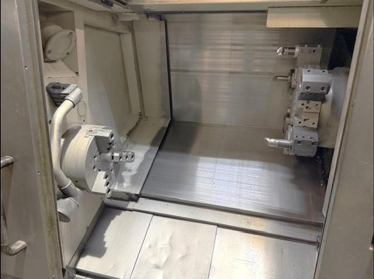 Used 2011 Doosan Puma 2600 with 10" Chuck, Tailstock, Tool Presetter, Chip Conveyor, Fanuc 0i Control