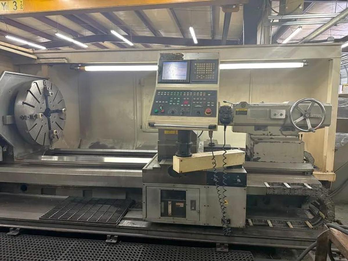 Used 2008 Hankook Protec 11NA with 43" sw, 29" Turn Diam, 78" cc, 4 Tool Manual Turret, Tailstock, Fanuc 21iTB Control, Conveyor