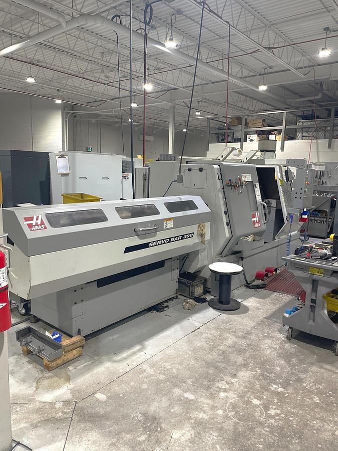 Used 2006 Haas SL-30T with Haas Servo 300 Barfeeder, 3" Bar Capacity, 10" Chuck, Tailstock, Toolsetter, Chip Auger, 12 Pos. Block Turret
