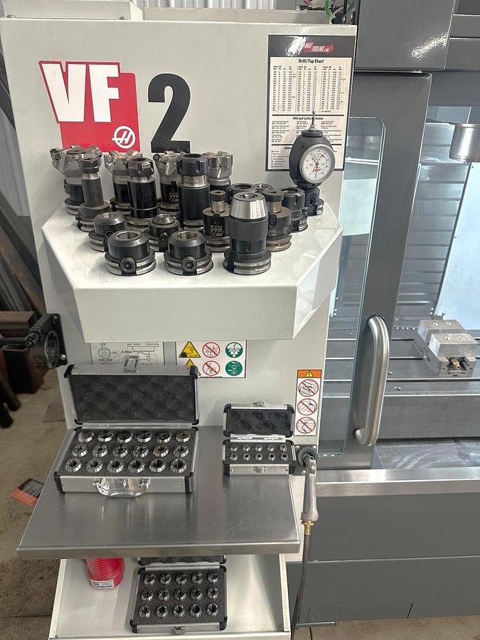 Used 2021 Haas VF2 with Auto Door, Rigid Tapping, 20 Station Carousel Type ATC, ONLY 30 FEED CUTTING HOURS!!