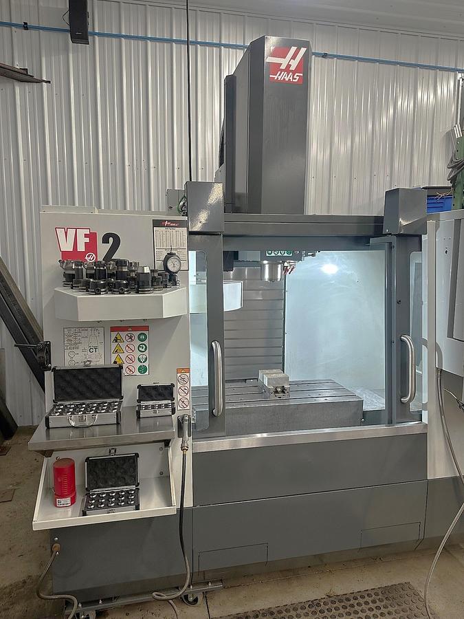 Used 2021 Haas VF2 with Auto Door, Rigid Tapping, 20 Station Carousel Type ATC, ONLY 30 FEED CUTTING HOURS!!