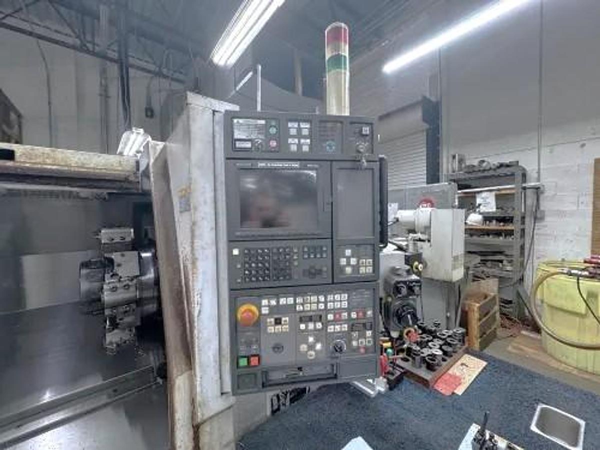 Used 2004 Mori Seiki SL-204MC with C Axis Rotation, Mill/Drilling Capability, Tailstock, Collet Chuck, Chip Conveyor, 2" Bar Capacity