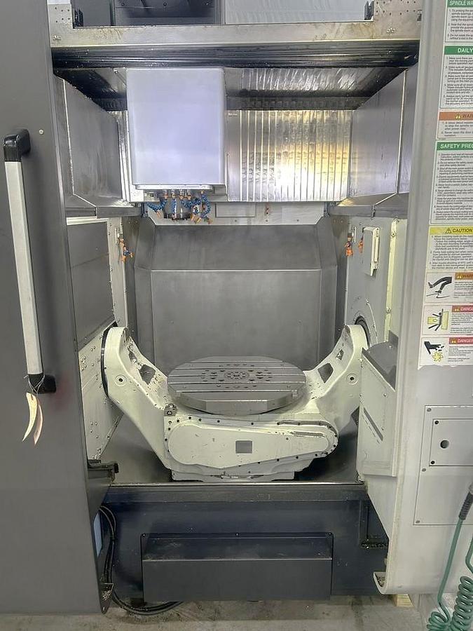 Used 2022 DN Solutions DVF 6500 5 Axis Trunnion VMC with 18,000 RPM, 60 ATC, Coolant Thru Spindle, Probing, Chip Conveyor