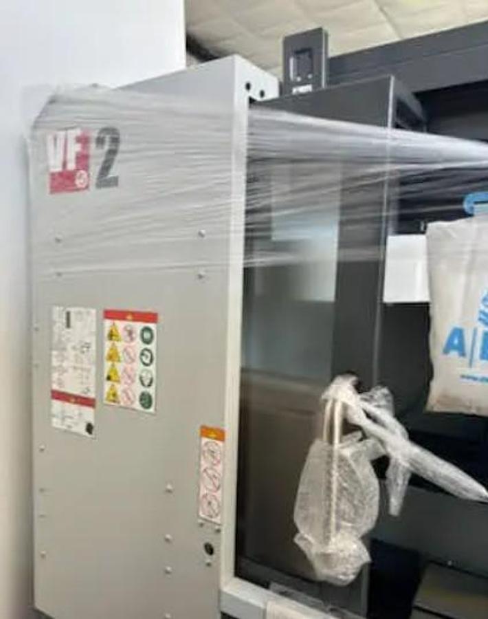 Used 2023 Haas VF-2 New never cut a part, has WIPS, Coolant Thru the Spindle Prepped, 4th Axis Drive & Wiring, Chip Conveyor