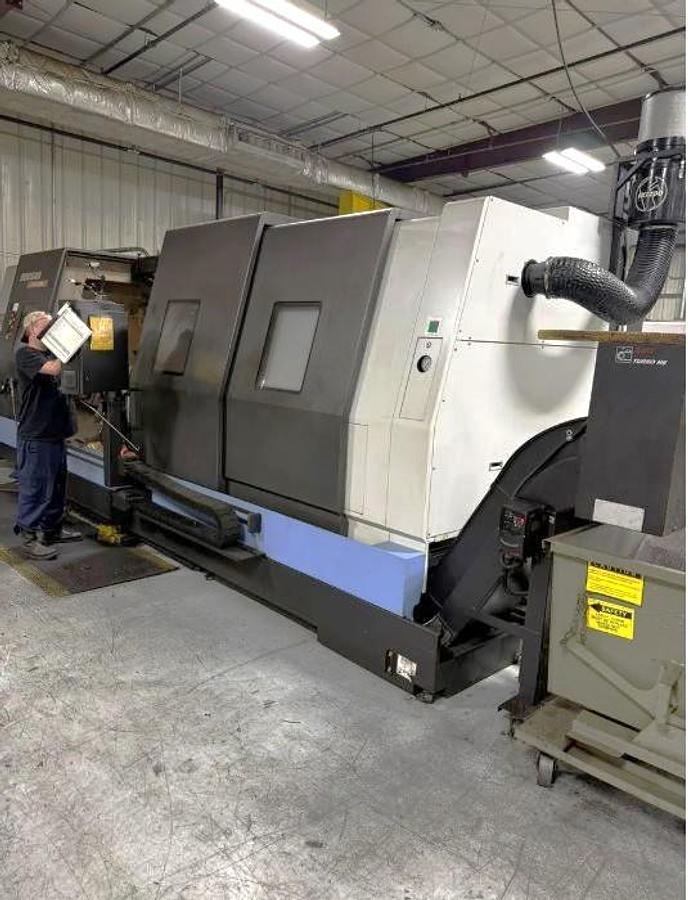 Used 2012 Doosan Puma 800L with, 24" 4 Jaw Man. Chk, 12.6" Bar Cap., 35.4" x 126" Capacity, Steady Rest, Tailstock, Conveyor