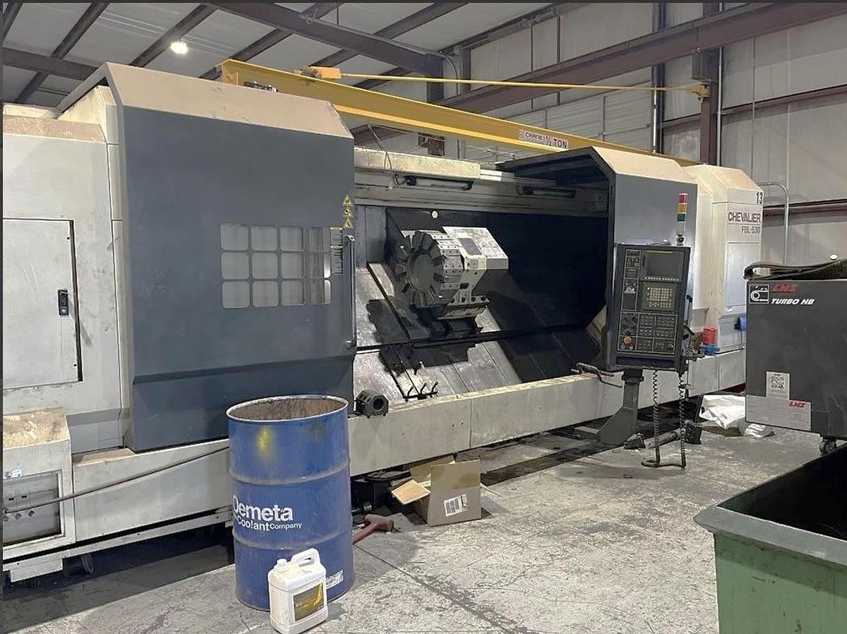 Used 2012 Chevalier FBL-530C with 12.59" Bore, 32" 4 Jaw Manual Front Chk, 28" Rear Air Chk, Tailstock, 118" cc, 500 RPM, Conveyor 