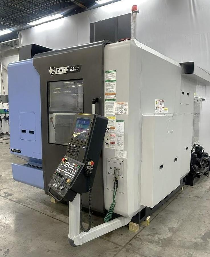 Used 2022 DN Solutions DVF 6500 5 Axis Trunnion VMC with 18,000 RPM, 60 ATC, Coolant Thru Spindle, Probing, Chip Conveyor