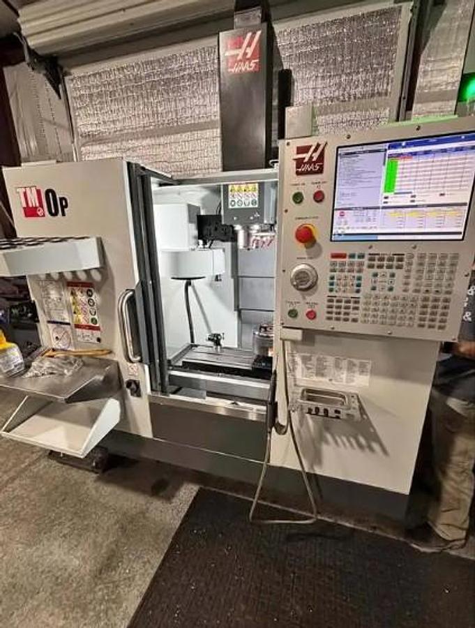 Used 2022 Haas TM-0P, 4th & 5th Axis Drives, WIPS Renishaw Part & Tool Probe, High-Speed Machining, Dynamic Work Offsets, Rigid Tapping, High-Flow Coolant Pump, Programmable Coolant Nozzle, Single or Three Phase