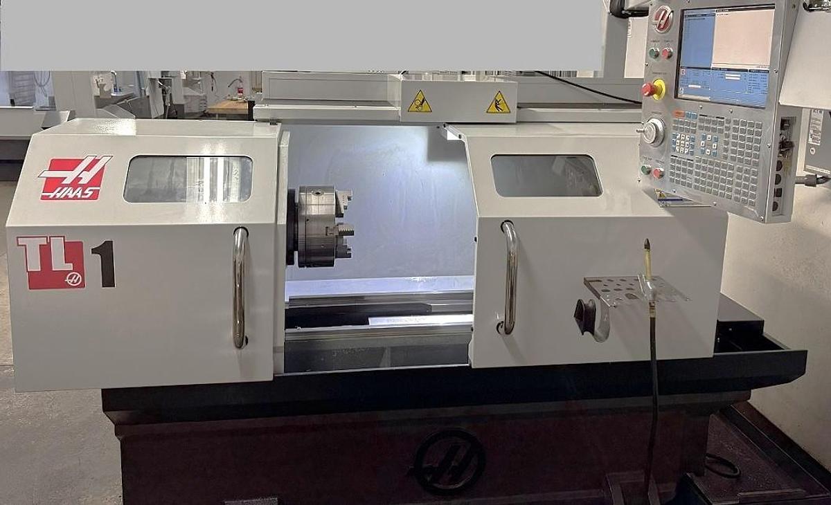 Used 2015 Haas TL-1 Chucker with A2-6" Nose, 3.5" Big Bore, Tool Post, 8" Chuck, 2000 RPM, Coolant, USB Port