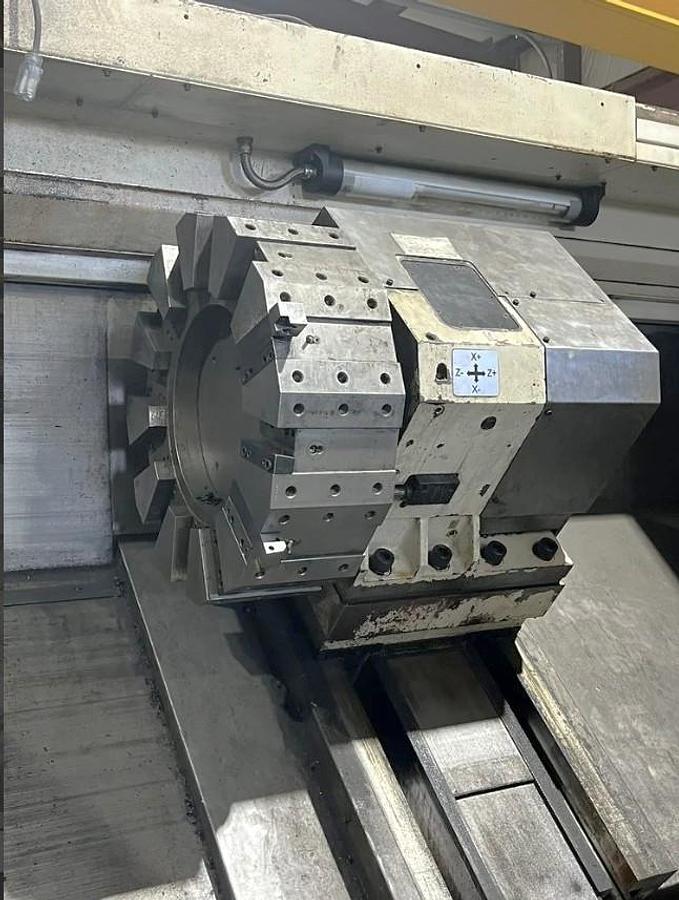 Used 2012 Chevalier FBL-530C with 12.59" Bore, 32" 4 Jaw Manual Front Chk, 28" Rear Air Chk, Tailstock, 118" cc, 500 RPM, Conveyor 