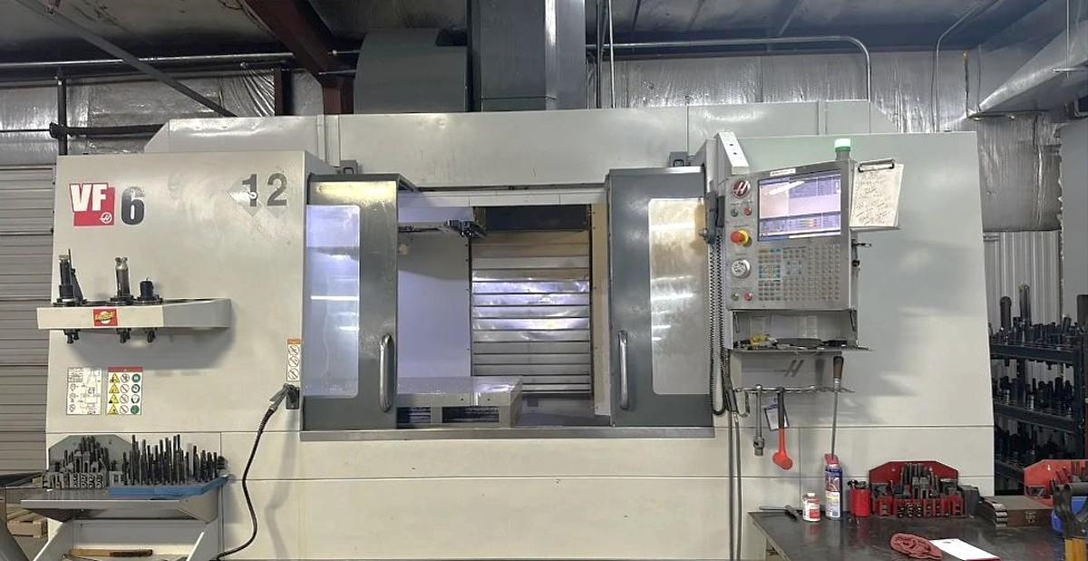 Used 2017 Haas VF-6/50 with 4th & 5th Axis Prewire, 8" Extended Z Axis Column, CT50 with (200) Toolholders,30 Pos. ATC, Chip Auger, Pcool