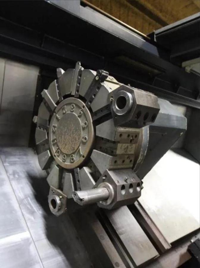 Used 2008 Doosan Puma 800L with, 39.4" 4 Jaw Man. Chk, 12.6" Bar Cap., 35.4" Turn Diam., 126" Turn Length, Tailstock, Conveyor