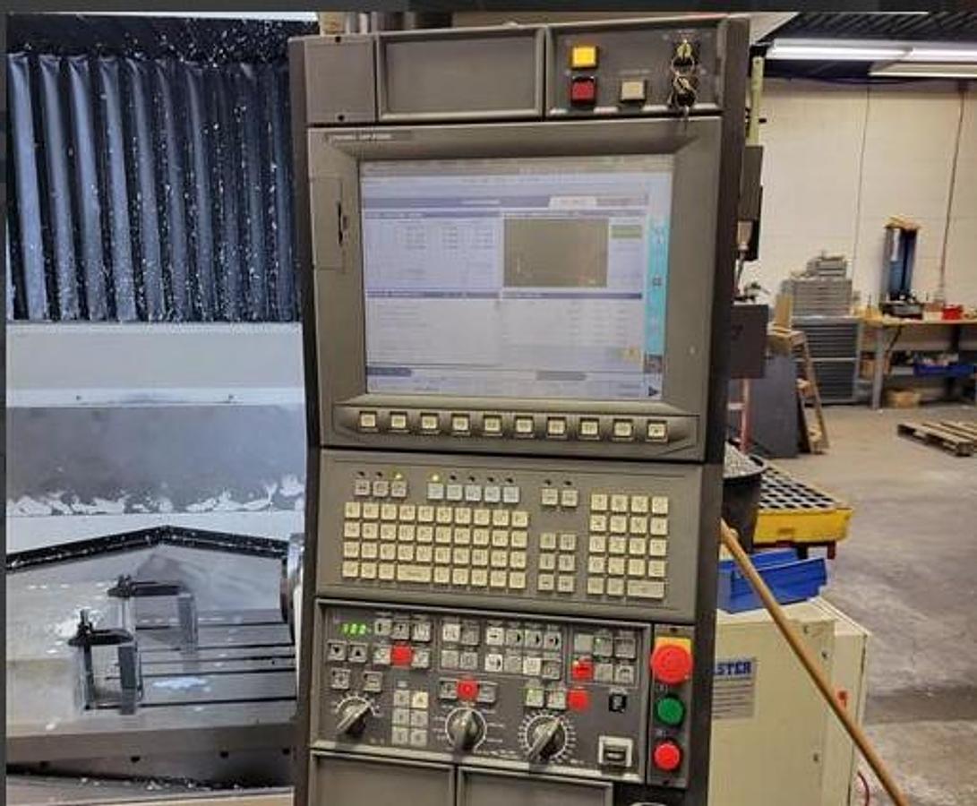 Used 2015 Okuma M560-V with 4th Axis Rotary Table, Renishaw Tool & Part Probing, 15k RPM, 32 Pos. ATC, Chip Claster HPC