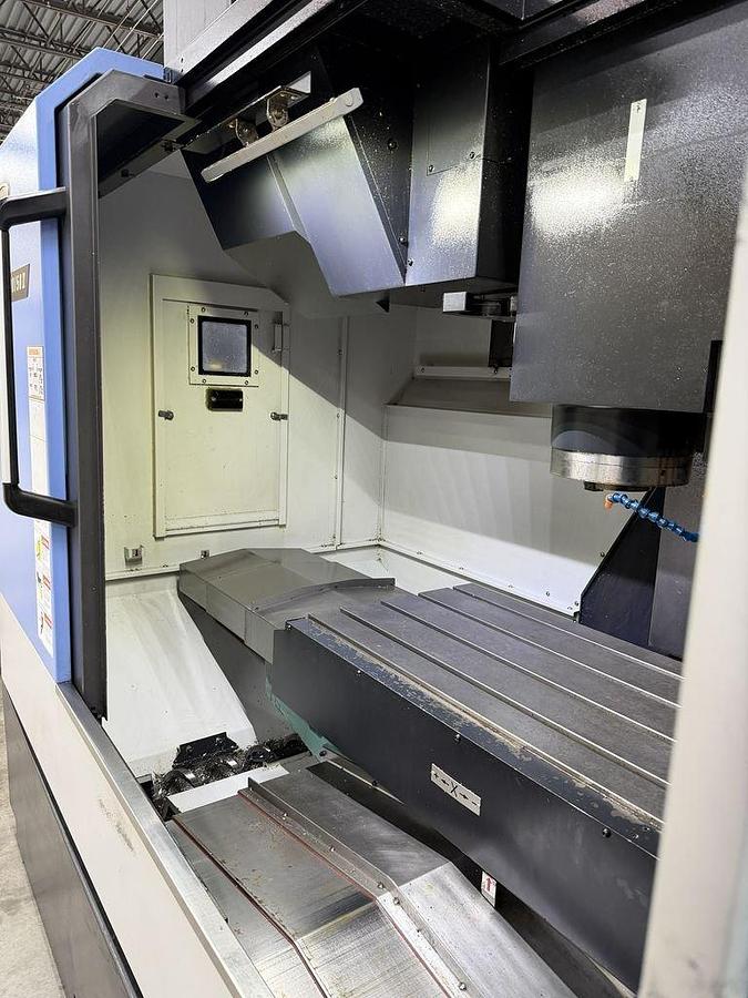 Used 2022 DN Solutions Mynx 5400/50 II with 4th Axis Drive, CAT50 Big Plus Spindle, Chip Conveyor, Mist Collector, Conversational