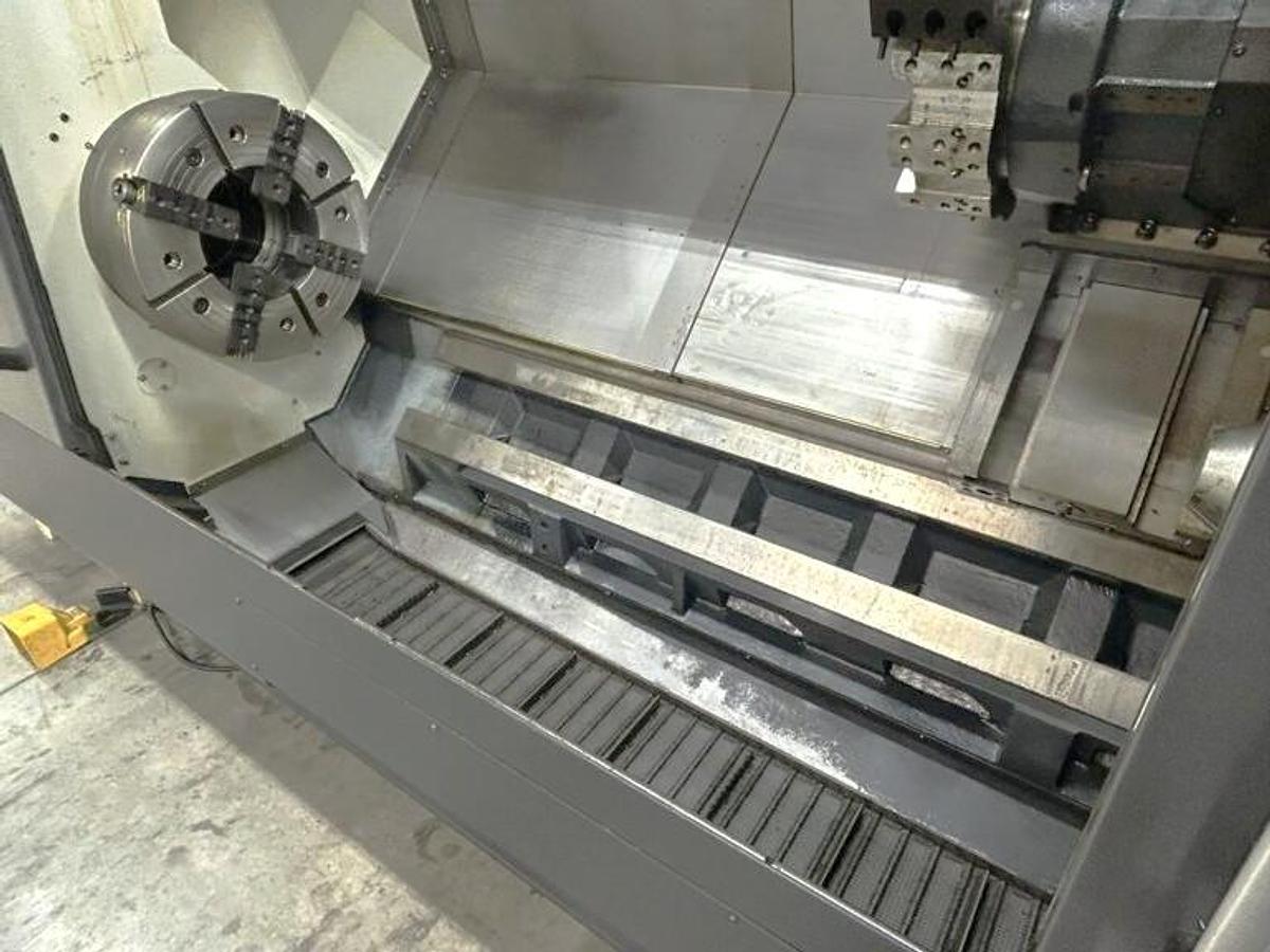 Used 2022 DN Solutions Puma 5100LC with 24.75" 4 Jaw Hyd. Chuck, 10.5" Spindle Bore, 82" Turn Length, Chip Conveyor, Tailstock