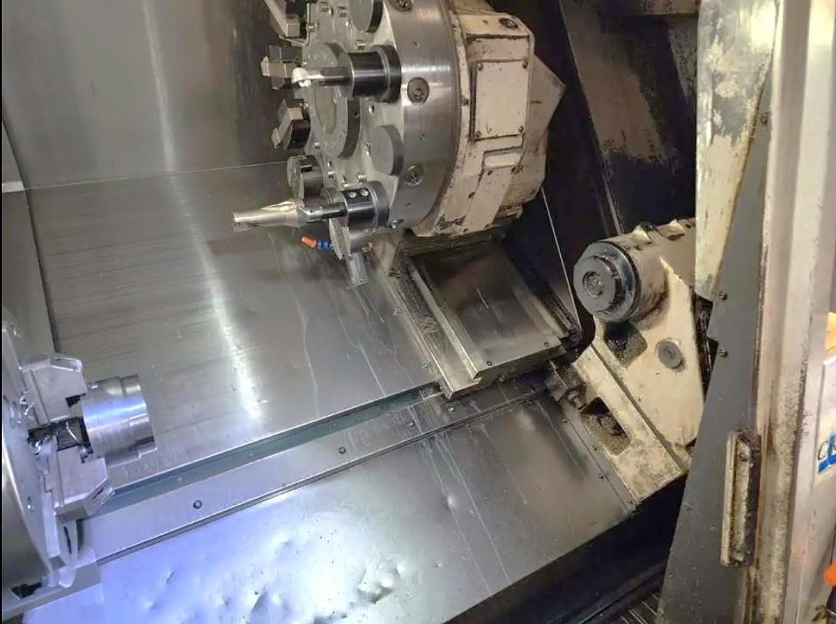Used 2005 Okuma Captain L470M with C Axis, Milling Capability, 12" Hyd. Chuck, Tailstock, Tool Presetter, Chip Conveyor