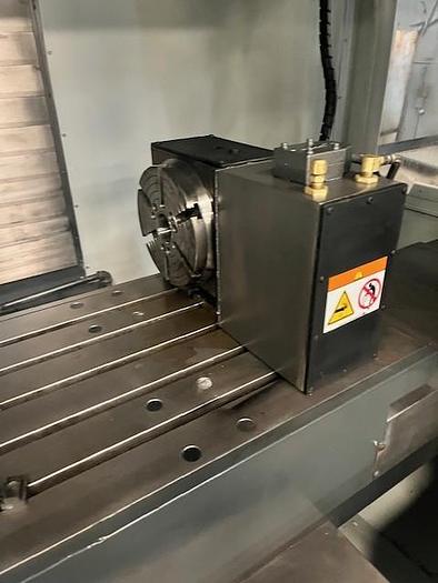 Used 2014 Haas VF4 with Haas HRT210 4th Axis Rotary Table, 24 Station SMATC, PCool, Chip Auger