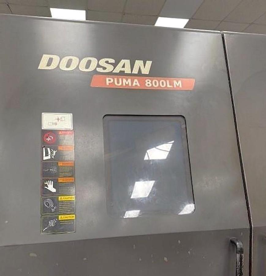 Used 2015 Doosan Puma 800LM with C Axis & Milling, 31.5" 3 Jaw Rohn Air Chk, 12.6" Bar Cap., 126" Turn Length, New RIP Steady Rest, Tailstock, Conveyor