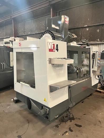 Used 2014 Haas VF4 with Haas HRT210 4th Axis Rotary Table, 24 Station SMATC, PCool, Chip Auger