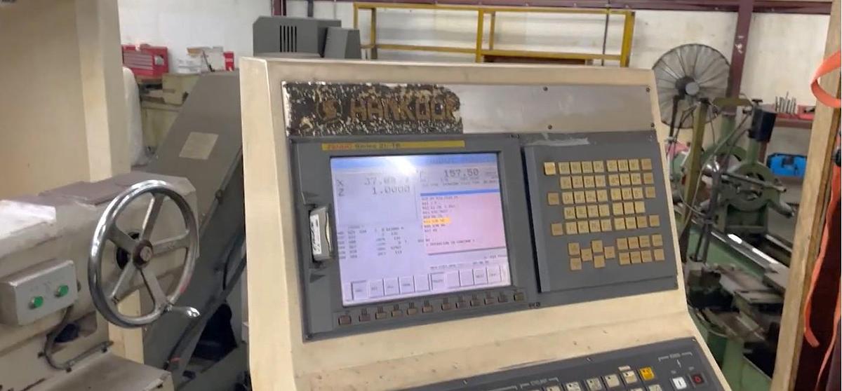 Used 2008 Hankook Protec 11NA with 43" sw, 29" Turn Diam, 78" cc, 4 Tool Manual Turret, Tailstock, Fanuc 21iTB Control, Conveyor
