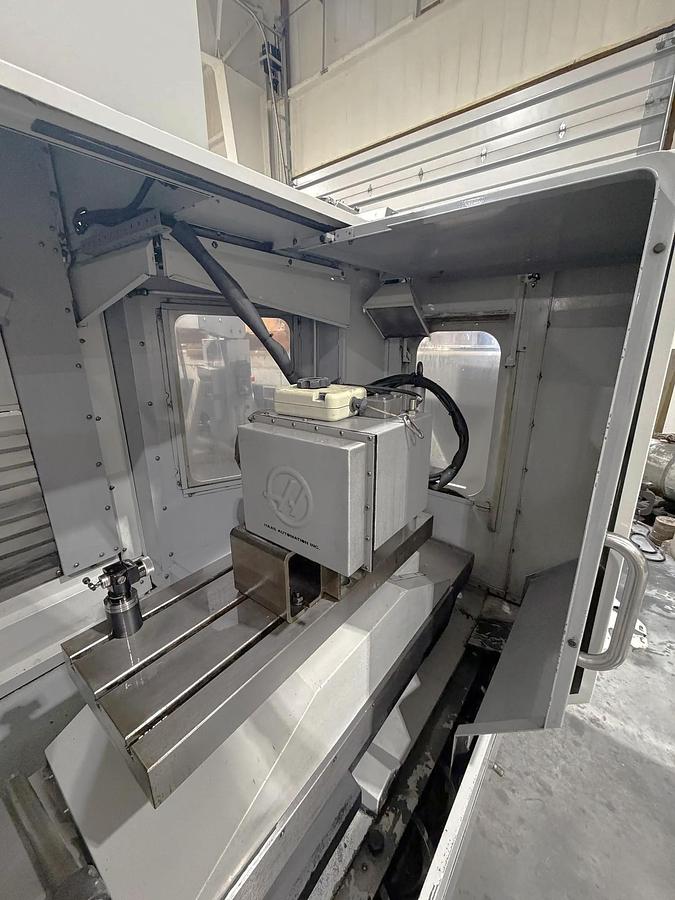 Used 2009 Haas ES-5-4T with HRT 4th Axis Rotary Table, Tool Probing, Remote Jog Handle, Chip Auger