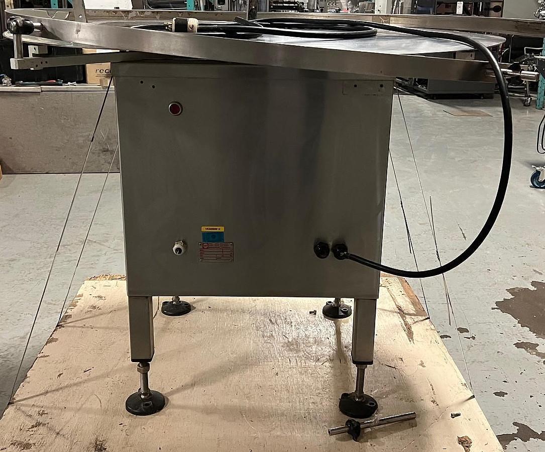 Used Capmatic 48" dia Accumulation table