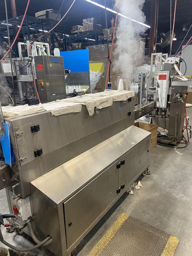 Used Aesus Eco Shrink Sleeve labeler with Steam Tunnel